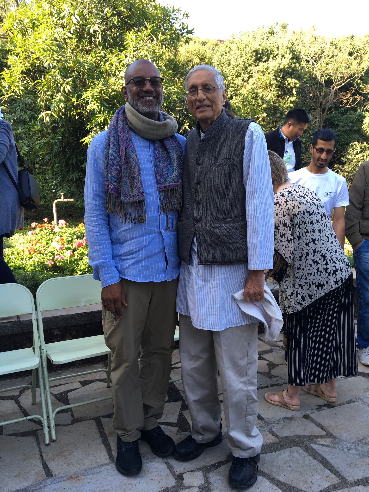 David and a colleague standing together outdoors, shown full length